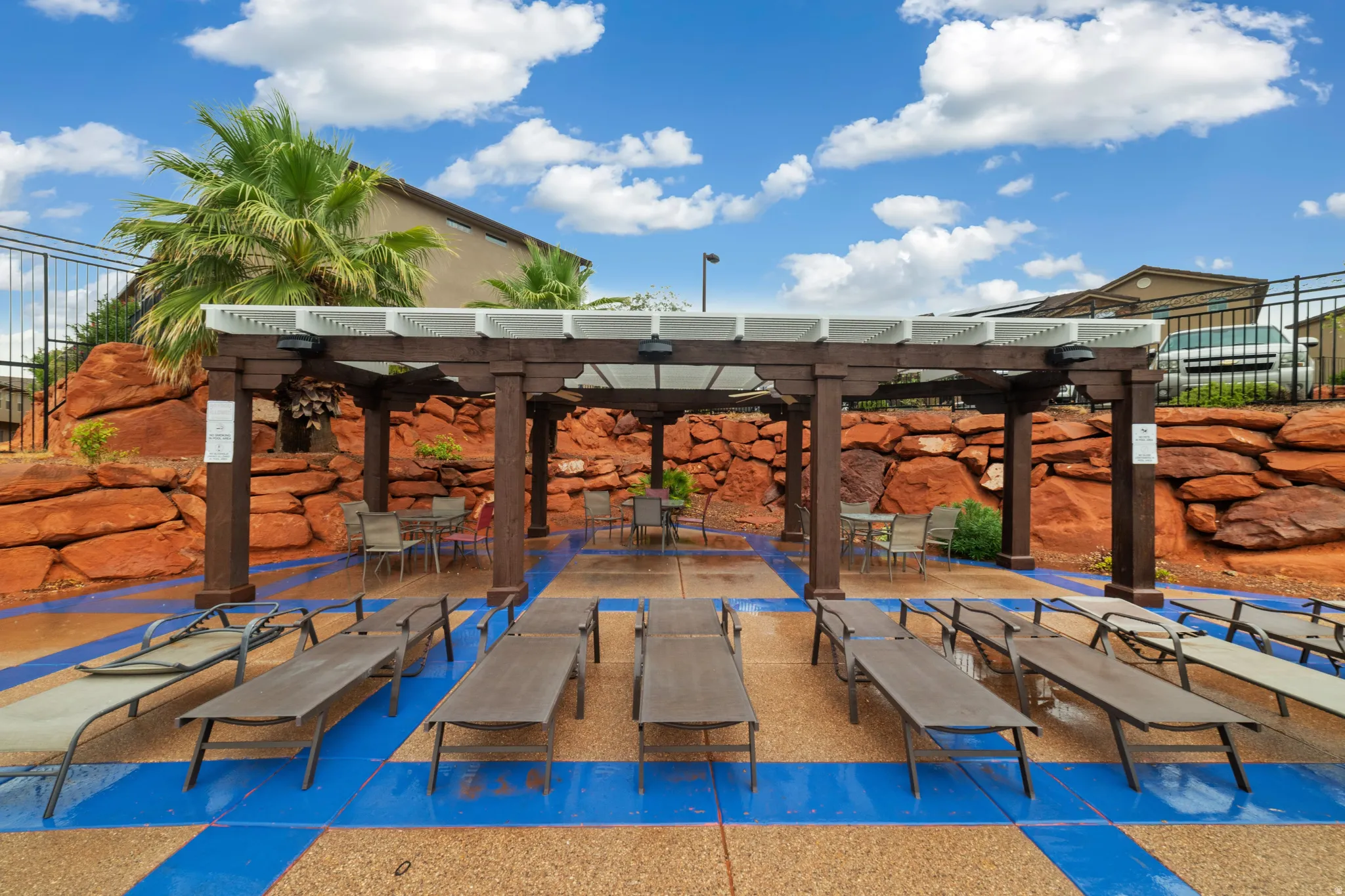 Expansive outdoor patio with a prominent wood pergola