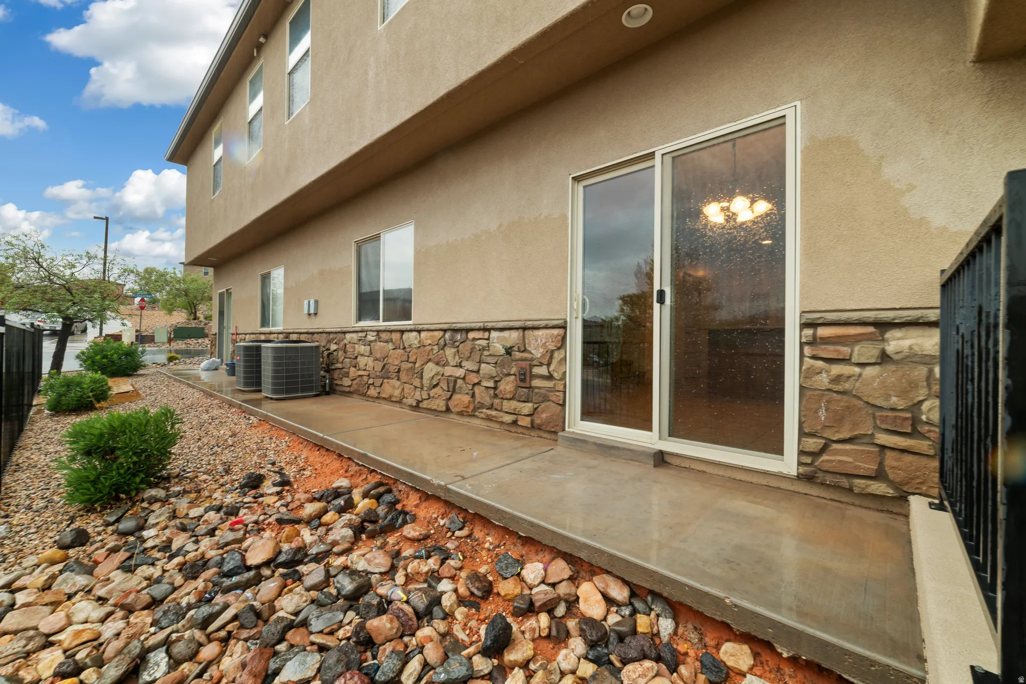 Exterior stucco finish with stone veneer accent