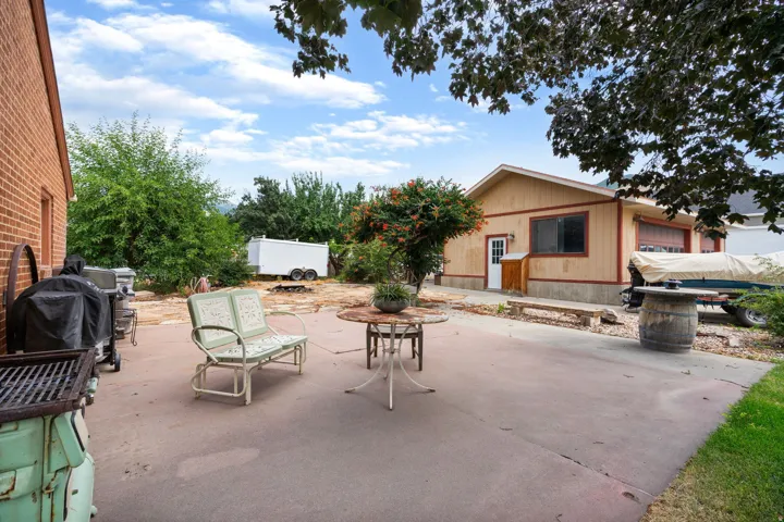 Expansive concrete patio area offering outdoor living space