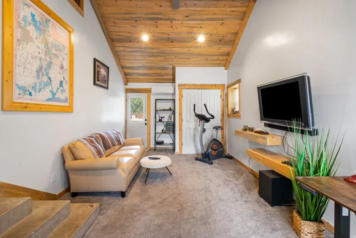 Vaulted wood-finish ceiling complemented by light gray walls