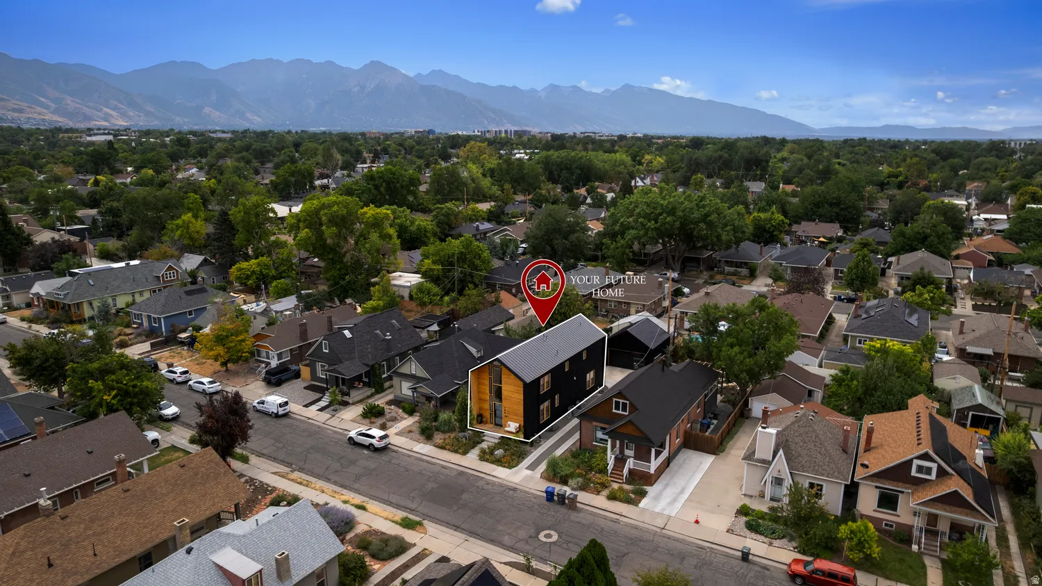 Modern multi-story property featuring a flat roofline and a combination of black siding and natural wood-tone accents