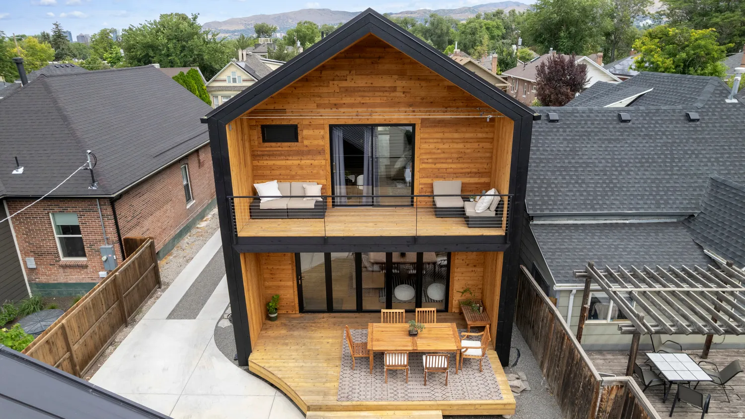 Modern residence with striking wood siding and black trim accents