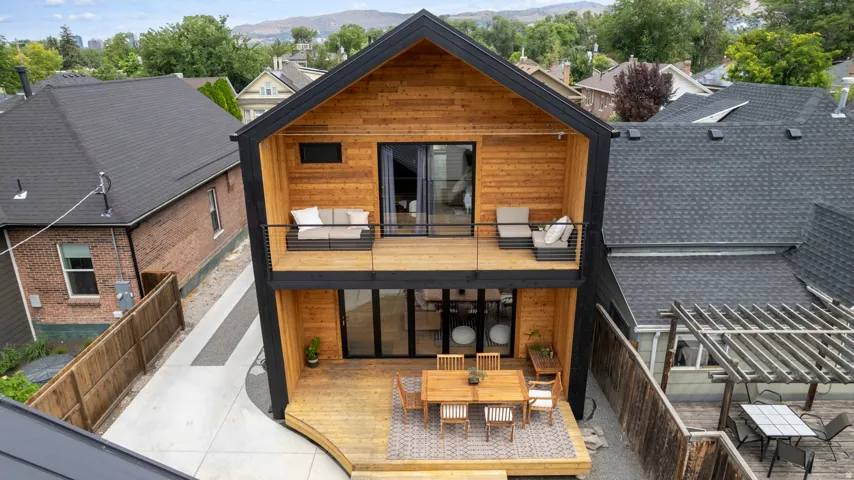 Modern residence with striking wood siding and black trim accents