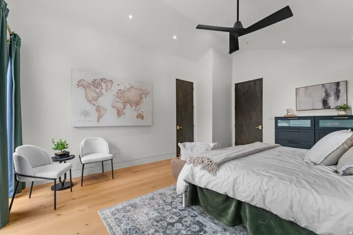 Vaulted ceiling with a contemporary black ceiling fan