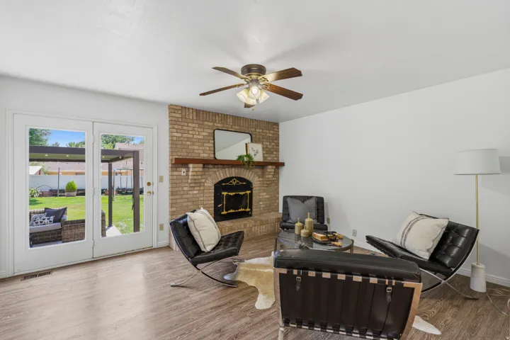 Main level, cozy sitting area with wood burning stove and access to backyard.