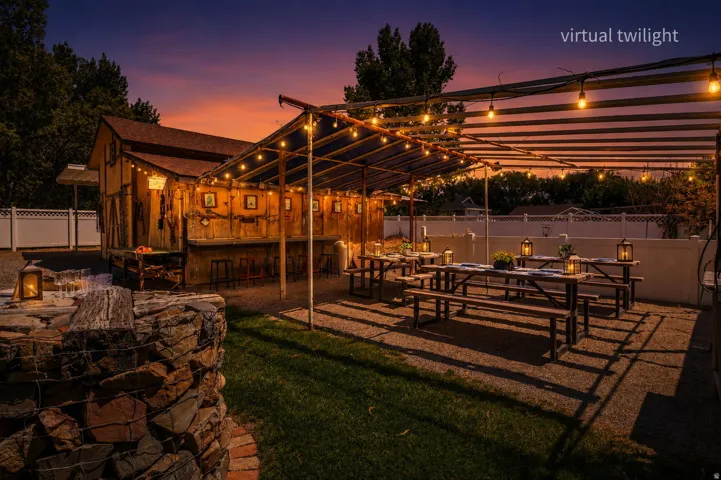 Evening view of Barn and outdoor entertainment /pergola dining area.