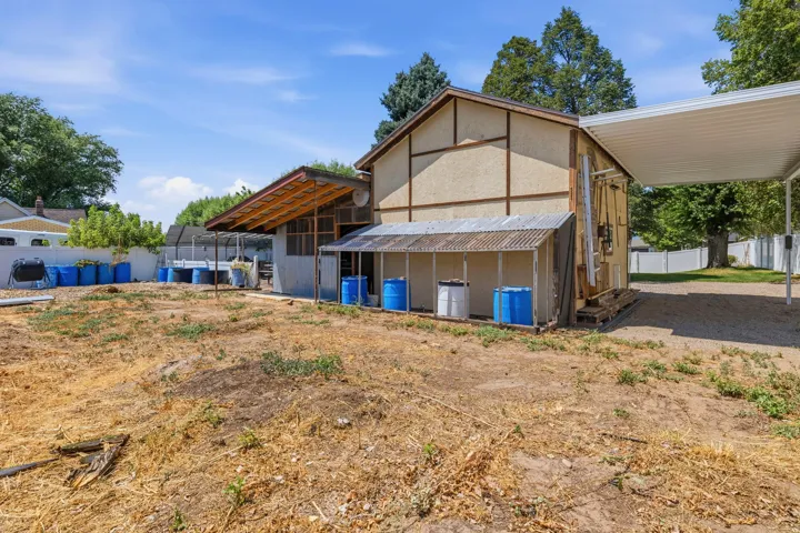 Backside of barn used as vegetable and flower garden.