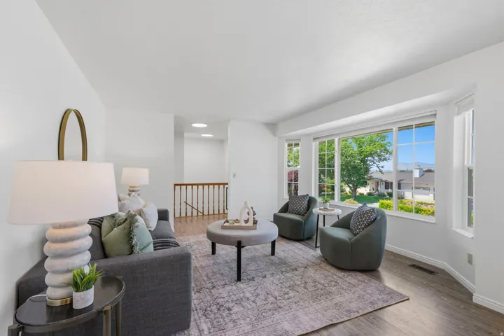 Large bay window in formal living room allows for plenty of natural light and mountain and valley views.