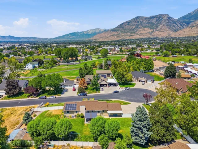 Aerial view of property with mountain views.