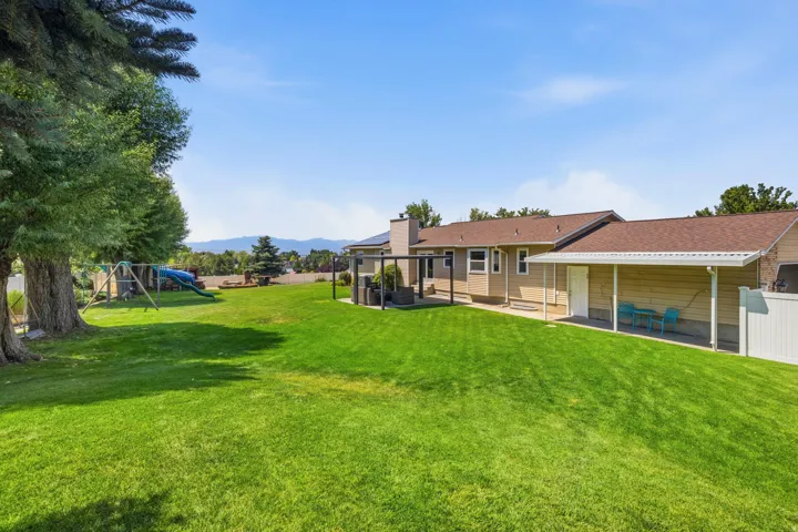 View of home from the barn with views of Utah Lake in the background.
