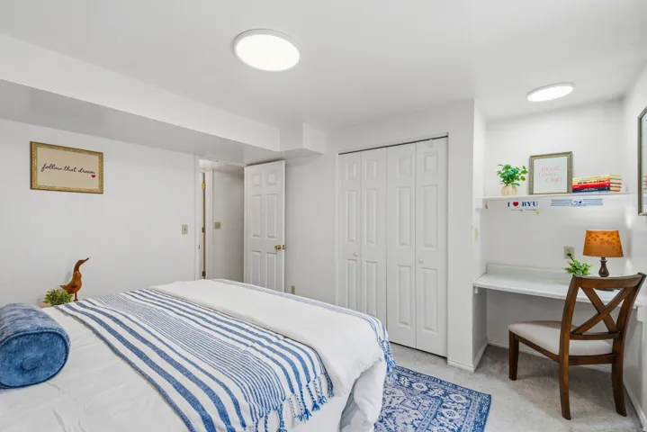 Lower level, bedroom #5 has a functional, built-in desk.