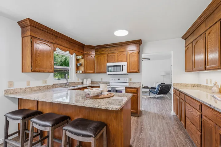 Kitchen with breakfast bar for casual seating, and a rear countertop that creates the perfect station for meal prep, serving, or entertaining.