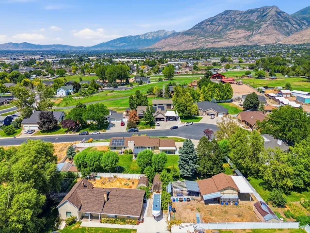 Aerial view of property with mountain views..