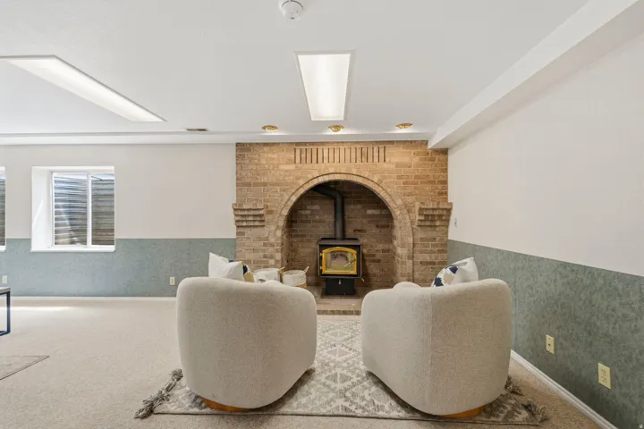 Lower level, cozy sitting area with wood burning stove.