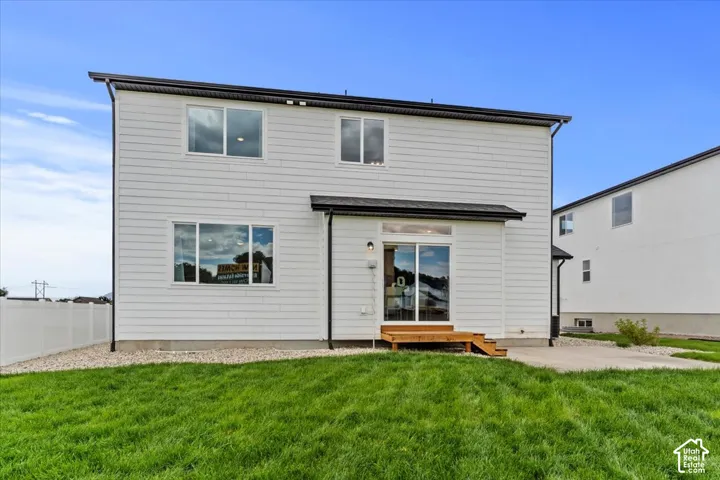 Contemporary exterior with white horizontal siding and black trim details