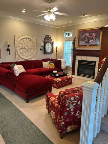 Living area featuring crown molding, recessed lighting, and a ceiling fan with integrated lighting