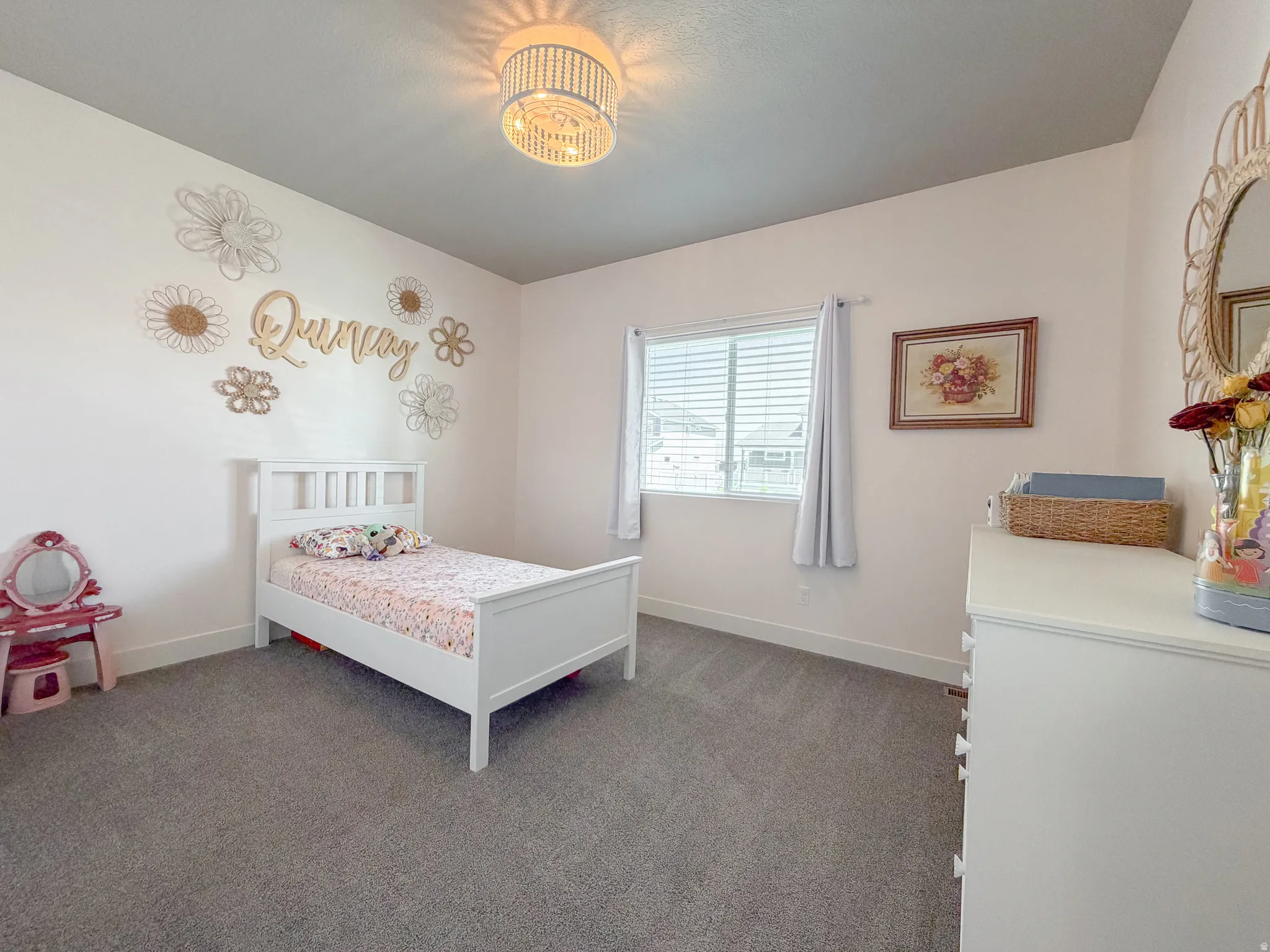 Neutral wall color with a contrasting ceiling, gray carpet flooring, and white baseboards