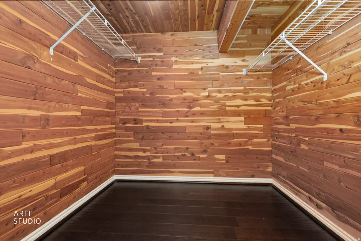 Cedar-paneled walls and ceiling with white wire shelving