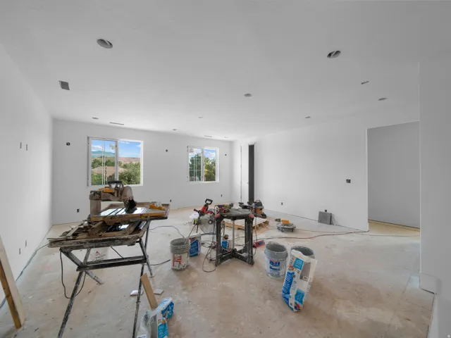 Spacious interior featuring multiple windows, recessed ceiling lighting, and a neutral wall palette