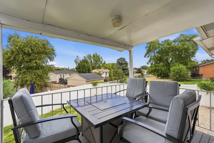 Covered outdoor patio with a white ceiling and exterior siding