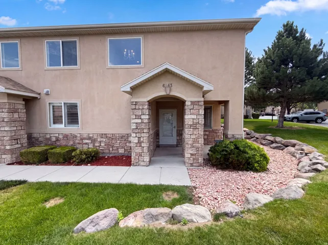 Stucco exterior with stone veneer accents