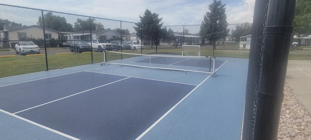 Dedicated pickleball court featuring two-tone blue surfacing and white court lines