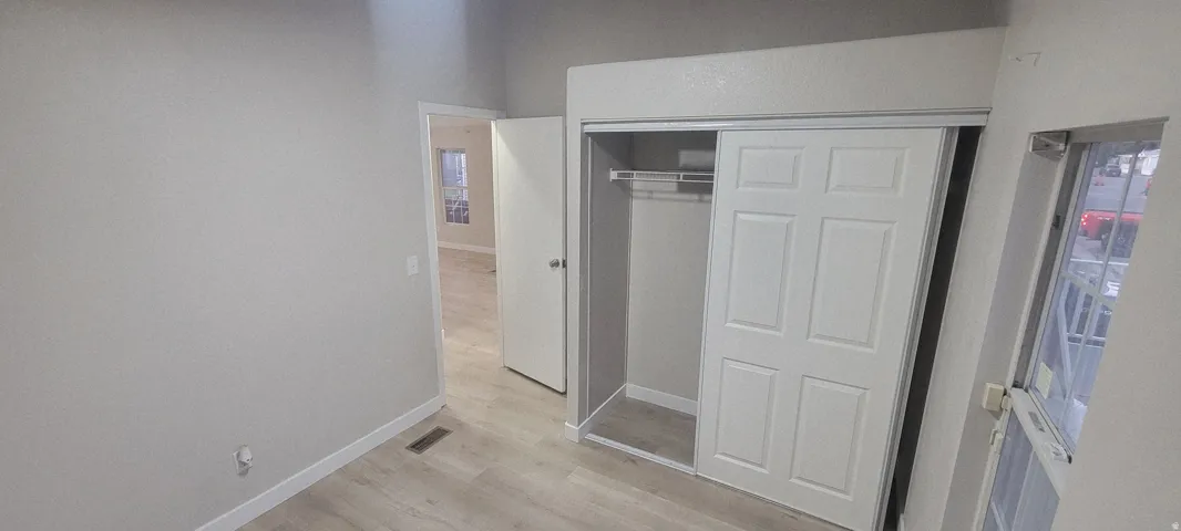 Sliding panel closet doors with integrated shelving and hanging rod