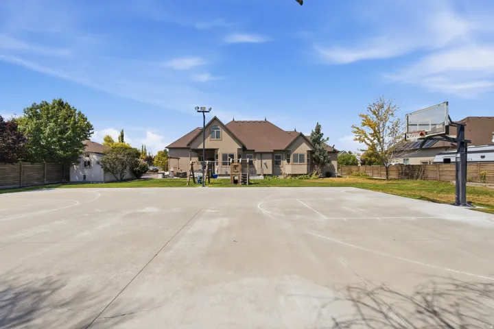 Expansive concrete sports court with a basketball hoop