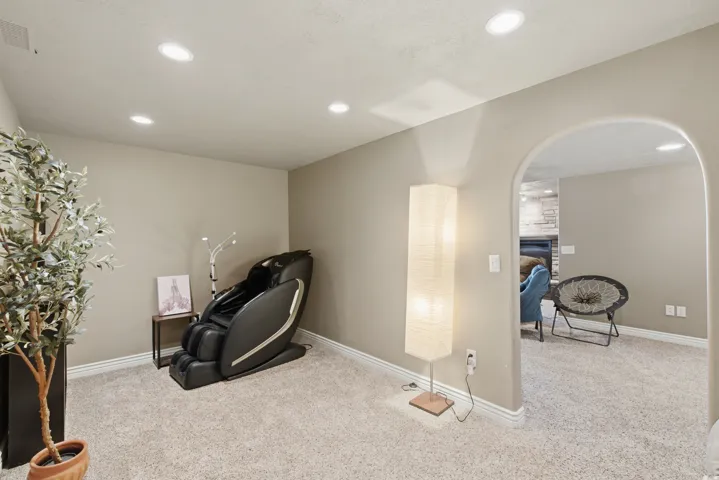 Zen Den/toy room with Recessed ceiling lighting with an arched entryway and light-toned wall finishes