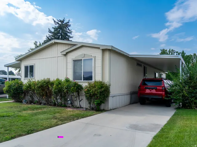 Cream-colored exterior siding with white trim