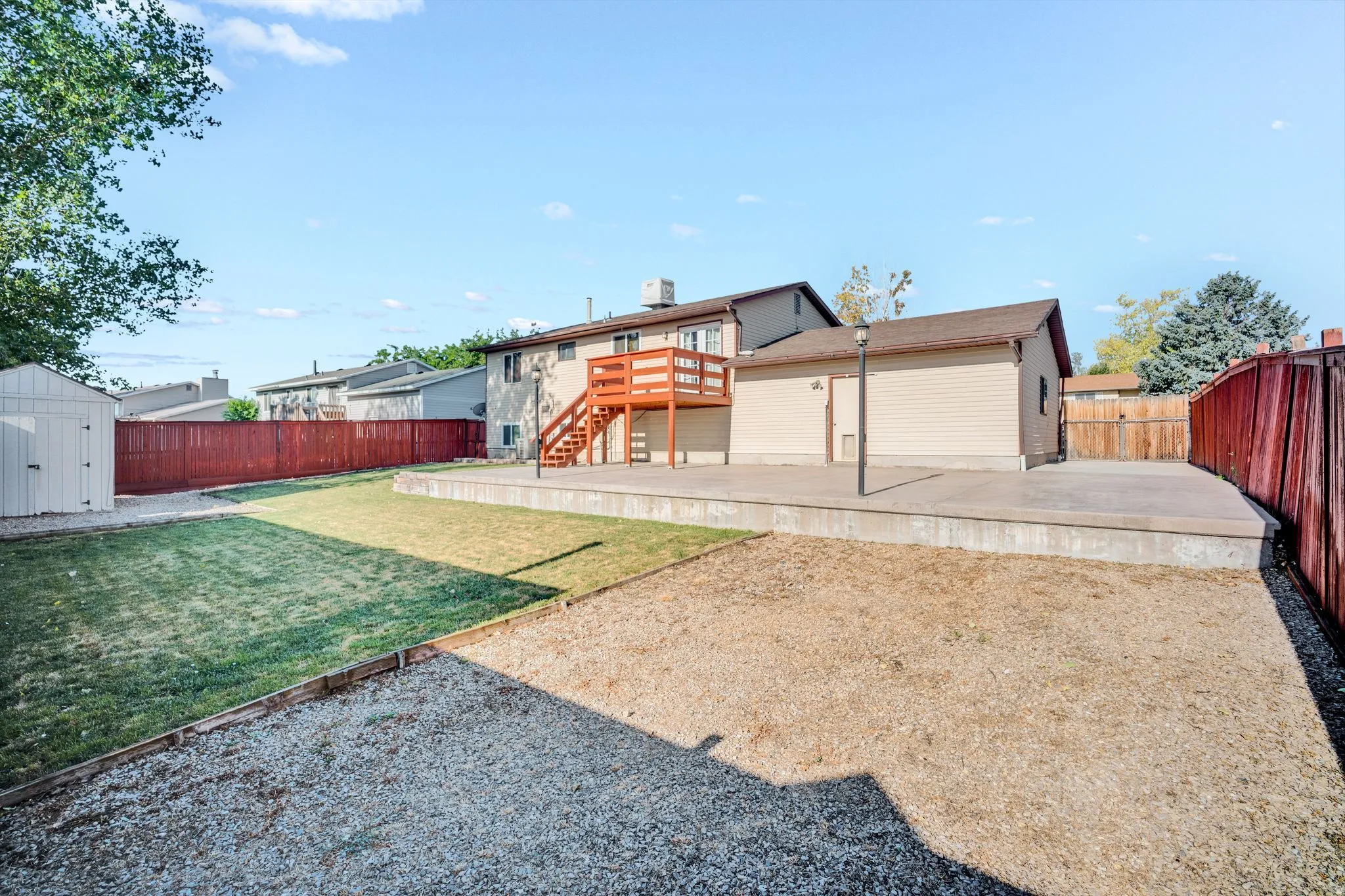 Expansive outdoor patio with an elevated concrete pad