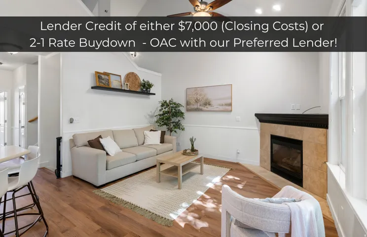Wood-finish flooring, fireplace with tile surround, vaulted ceiling, and built-in shelving