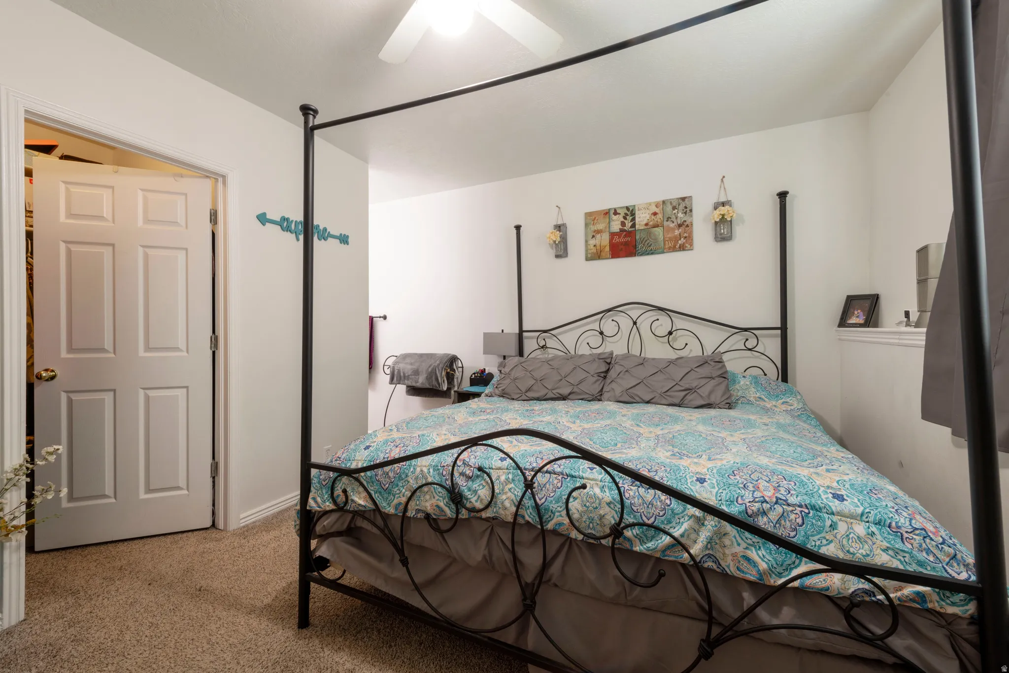 Bedroom featuring light-colored walls and neutral carpeting
