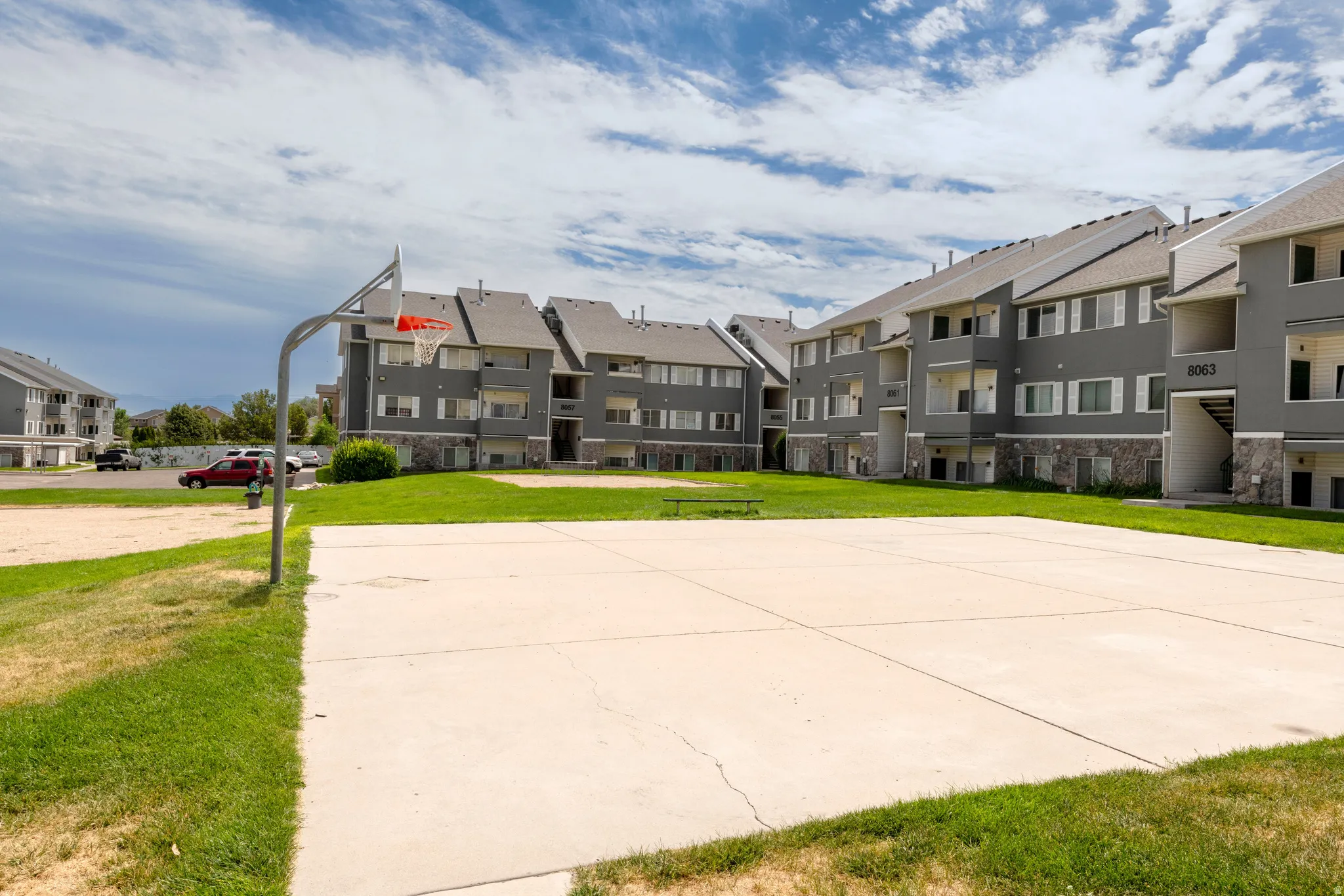 Recreational court with basketball hoop