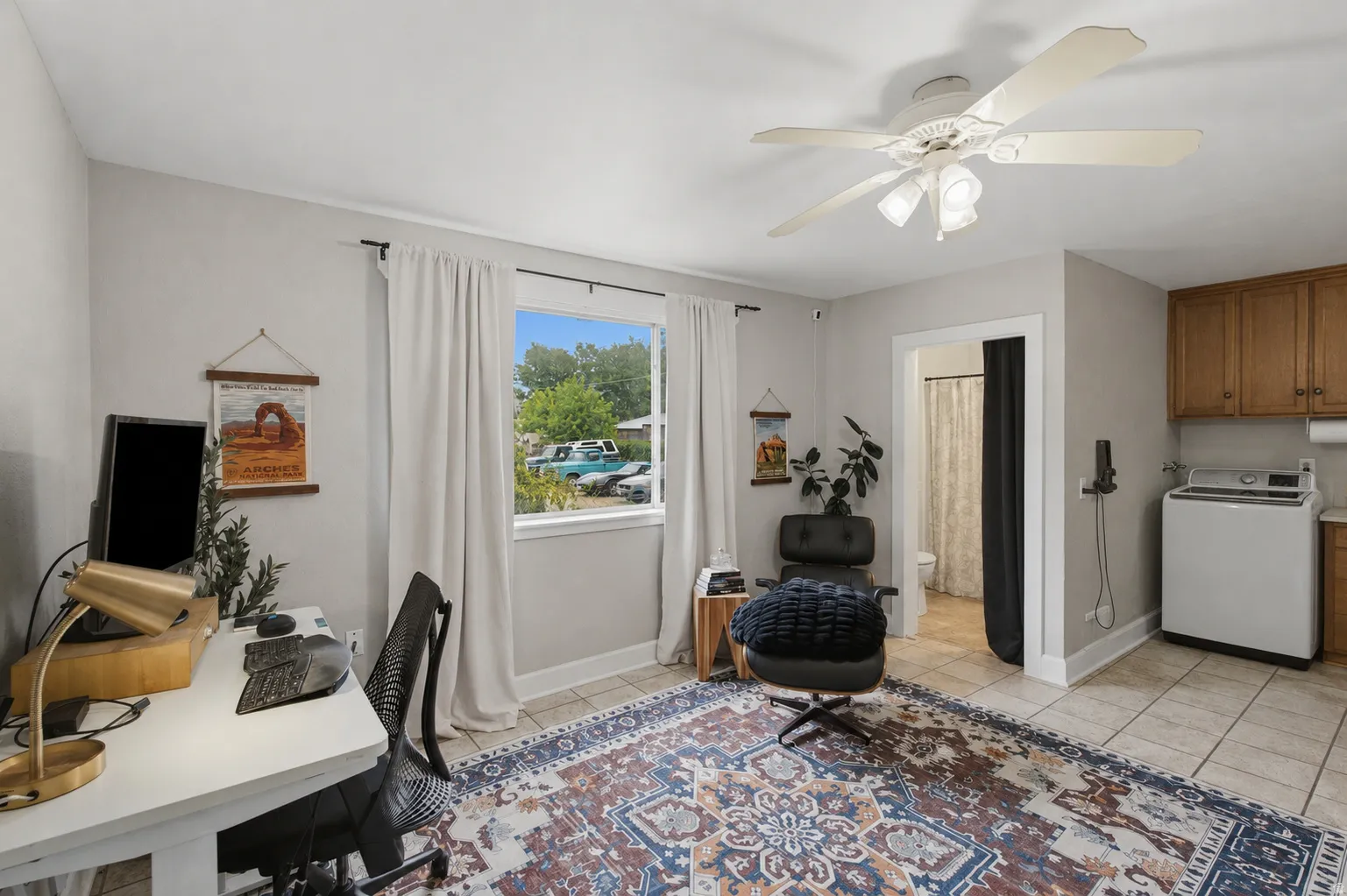 Natural light and tile flooring throughout the laundry room and office gives this space a nice, tranquil feel.