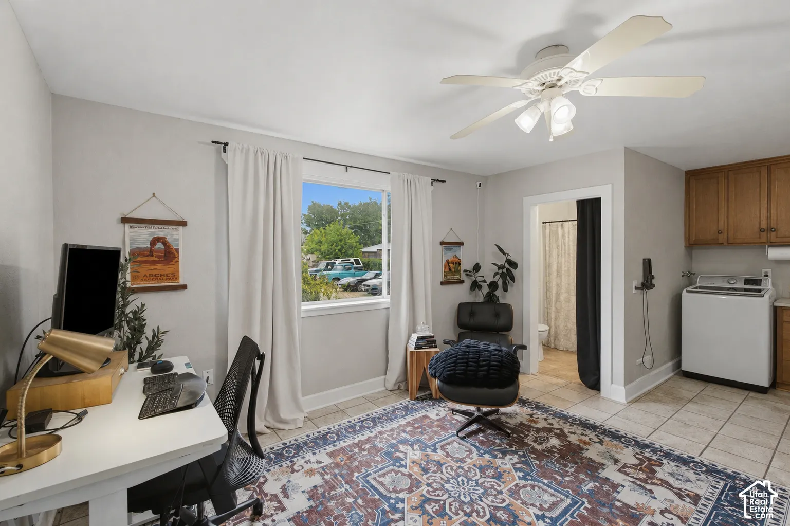 Natural light and tile flooring throughout the laundry room and office gives this space a nice, tranquil feel.