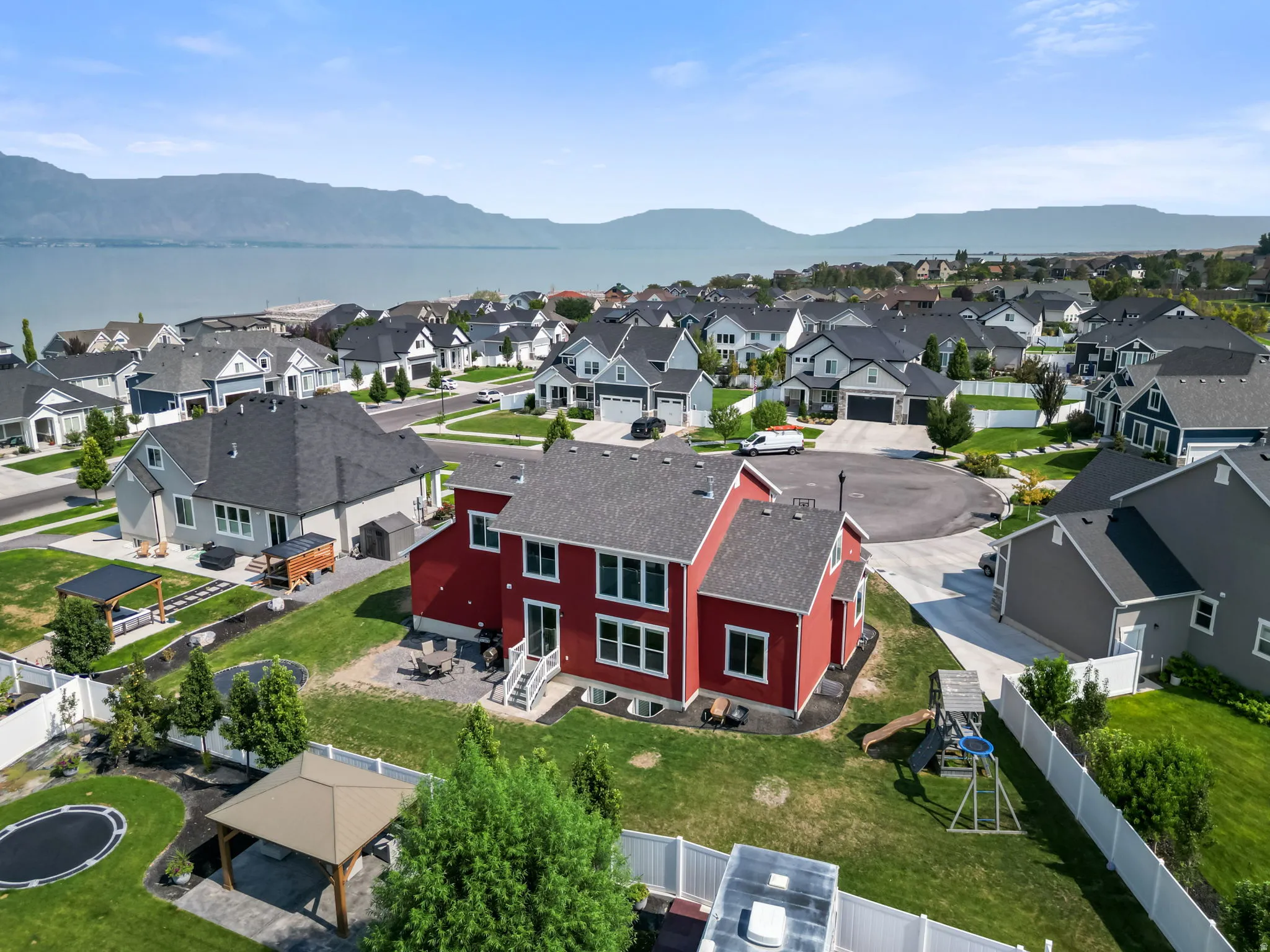 Lakeside community setting with mountain backdrop