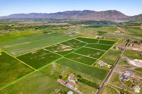 Expansive land parcels outlined in green and yellow, surrounded by green fields