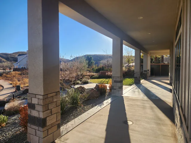 Covered patio featuring recessed lighting and concrete flooring