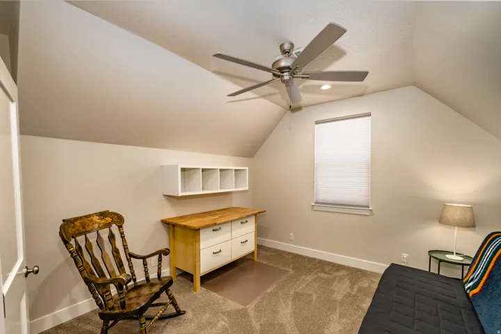 Room with vaulted ceilings and neutral wall tones