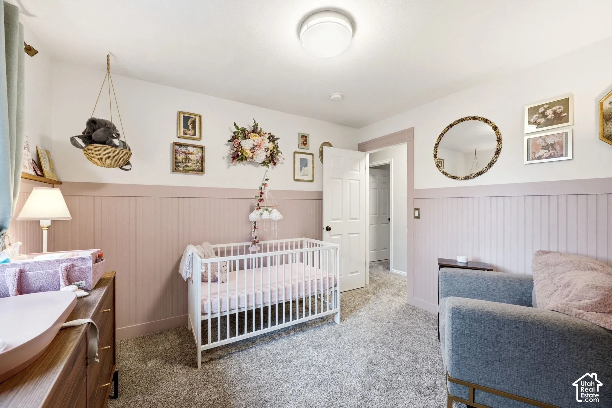 Room featuring wainscoting, wall-to-wall carpeting, and a flush mount ceiling light