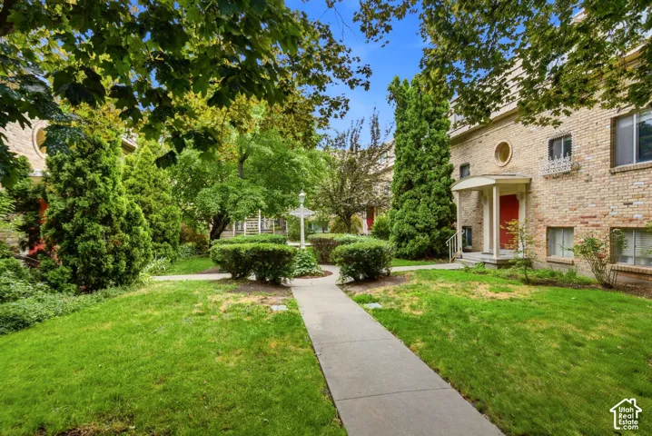 Enchanting French inspired courtyard with mature trees.