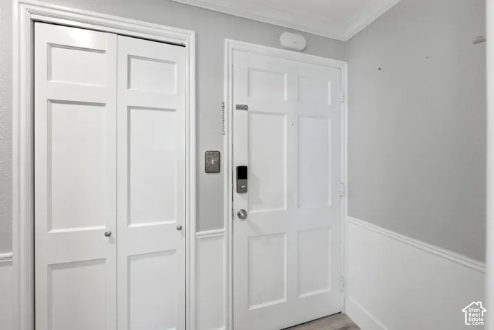 Front door with keypad entry and spacious coat closet/storage area.