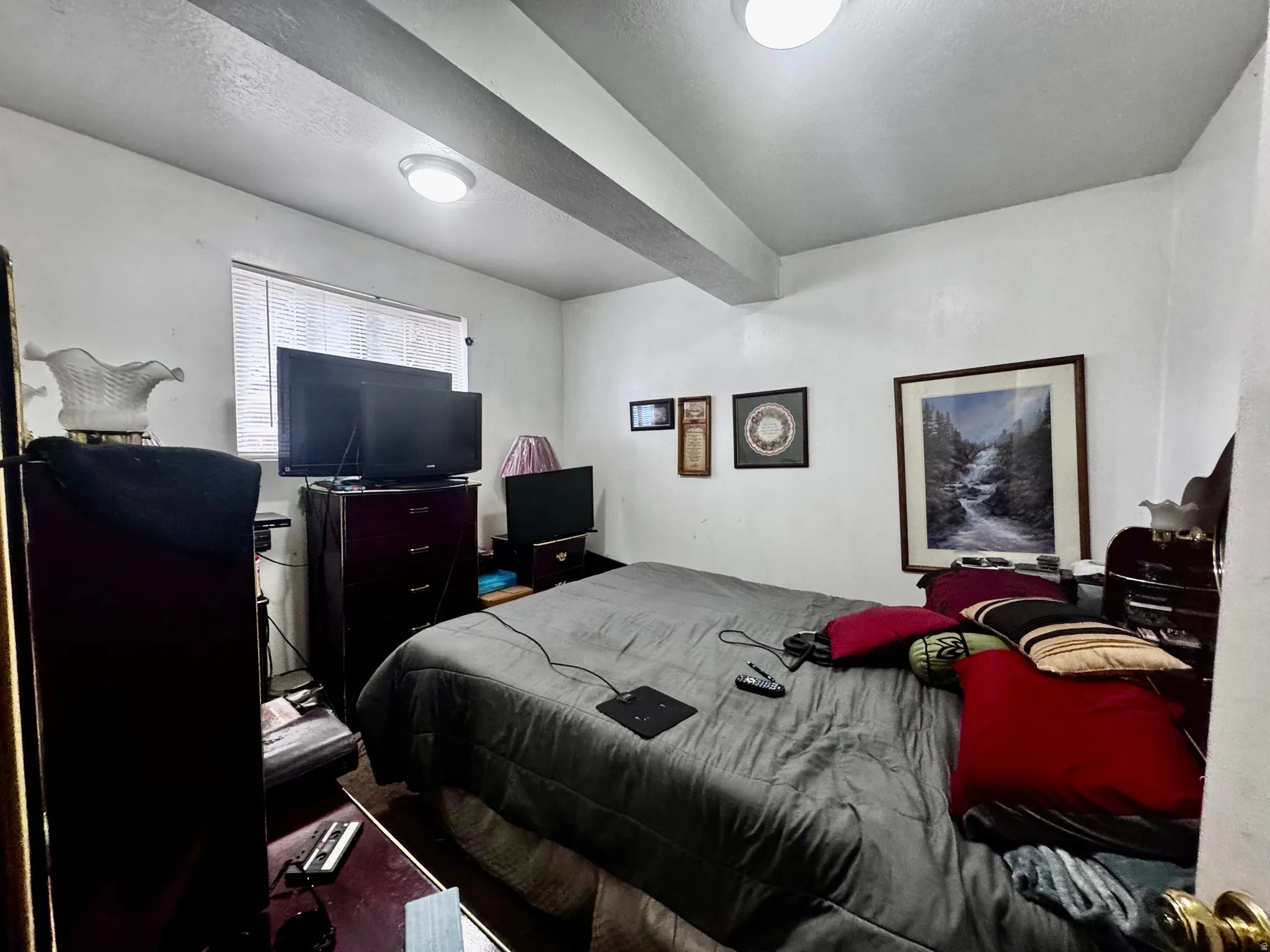 White-painted walls and ceiling with exposed structural beams