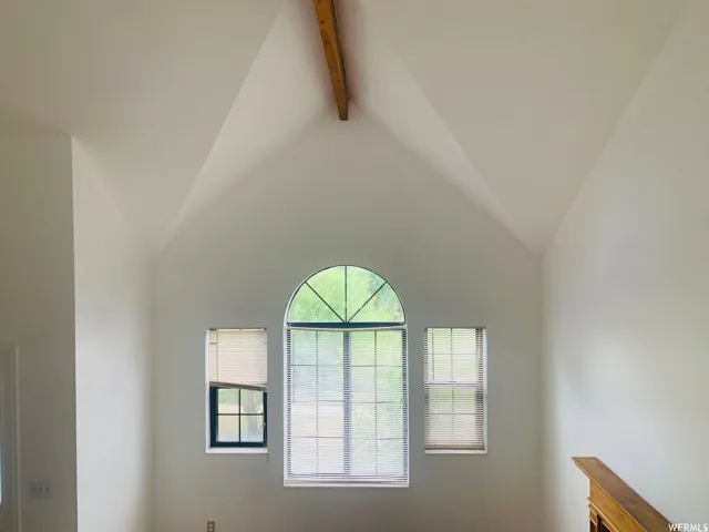 Vaulted ceiling with an exposed wood beam