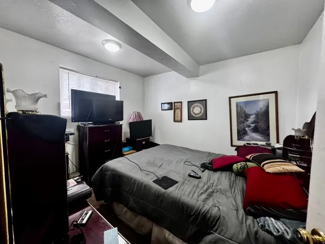 White-painted walls and ceiling with exposed structural beams