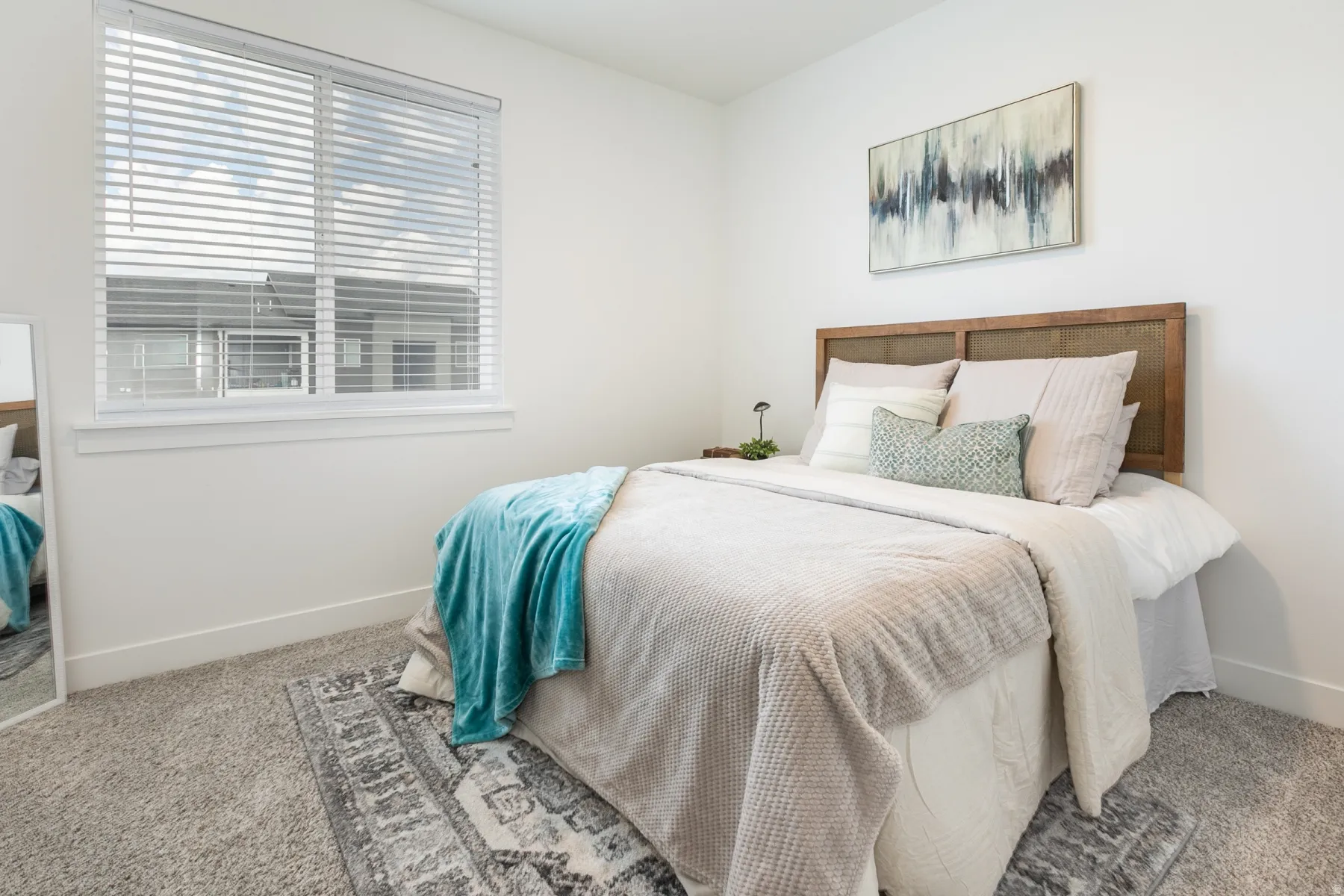 White walls and neutral carpet flooring define this interior space
