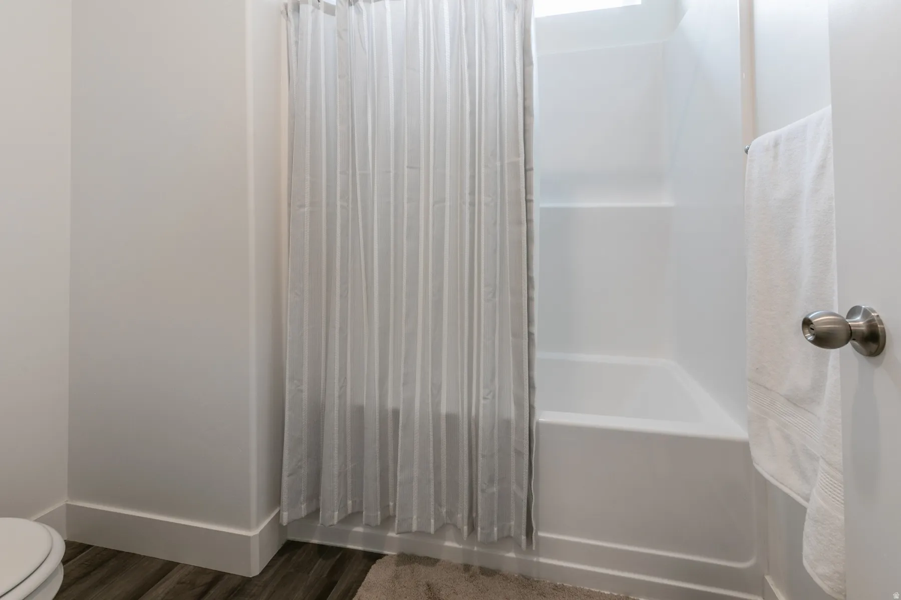 White bathtub and shower combination unit