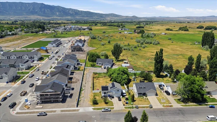 Aerial perspective showcasing a residential area with new construction and established homes