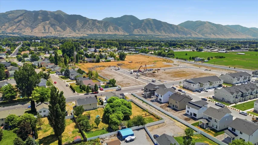 Aerial perspective showcasing a residential development with mountain backdrop